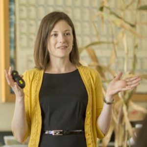 Woman talking at front of room