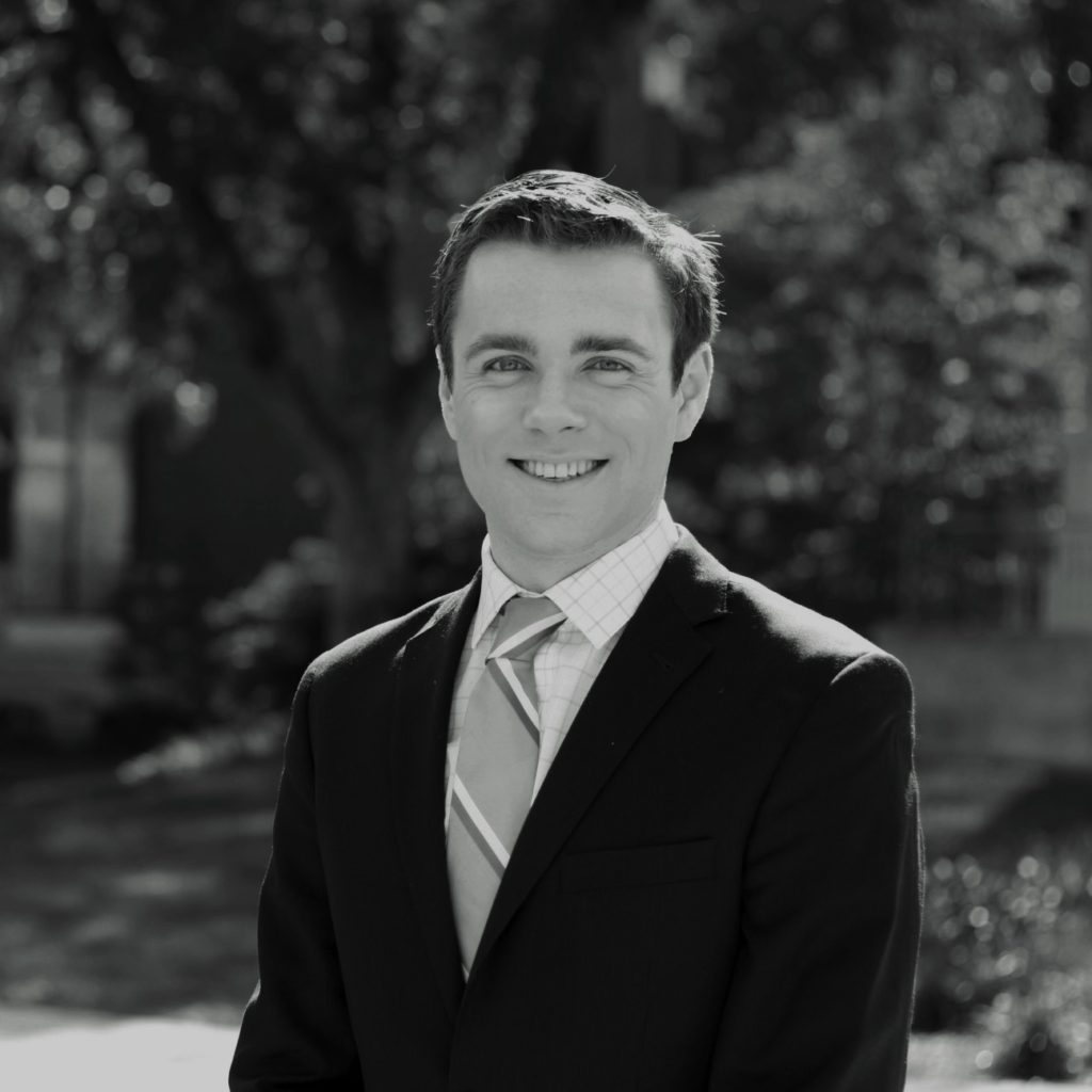 Young man in coat and tie